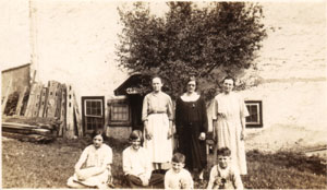 Rebecca Gable, with grown Verda and small children.  They are standing where the Reunion holds the egg toss each year.